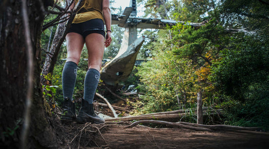 Hiker wearing Cloudline merino wool compression socks while exploring Vancouver Island.