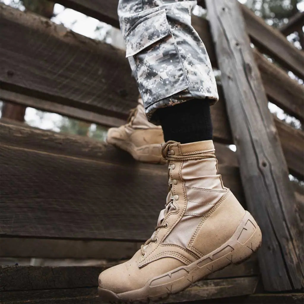 Man wearing Cloudline merino wool tactical crew socks while on obstacle course.