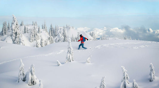 Snowy adventure: Hiker embarking on a trek through the winter landscape.