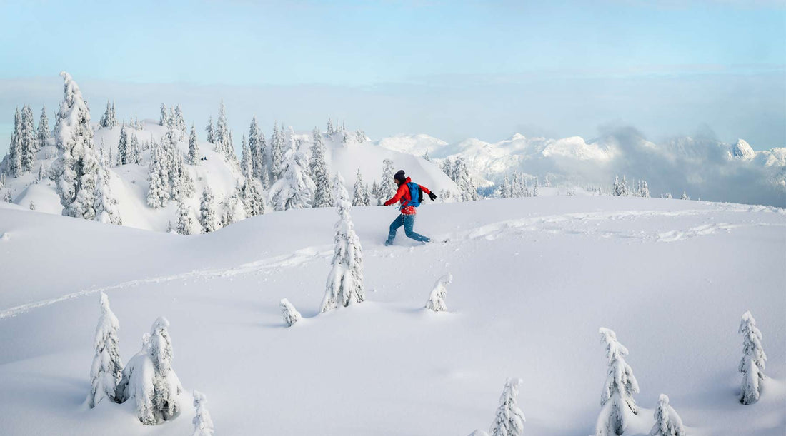 Snowy adventure: Hiker embarking on a trek through the winter landscape.