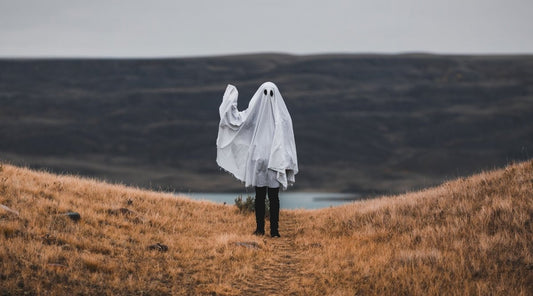 Hiker wearing a ghost costume on the trail.