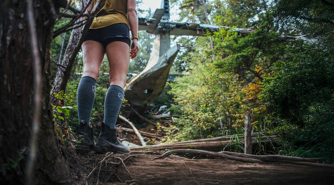 Hiker wearing Cloudline merino wool compression socks while exploring Vancouver Island.