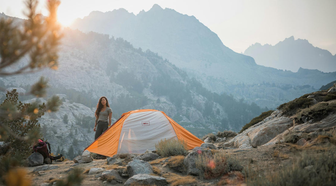 Women camping in the backcountry with tent and backpacking pack