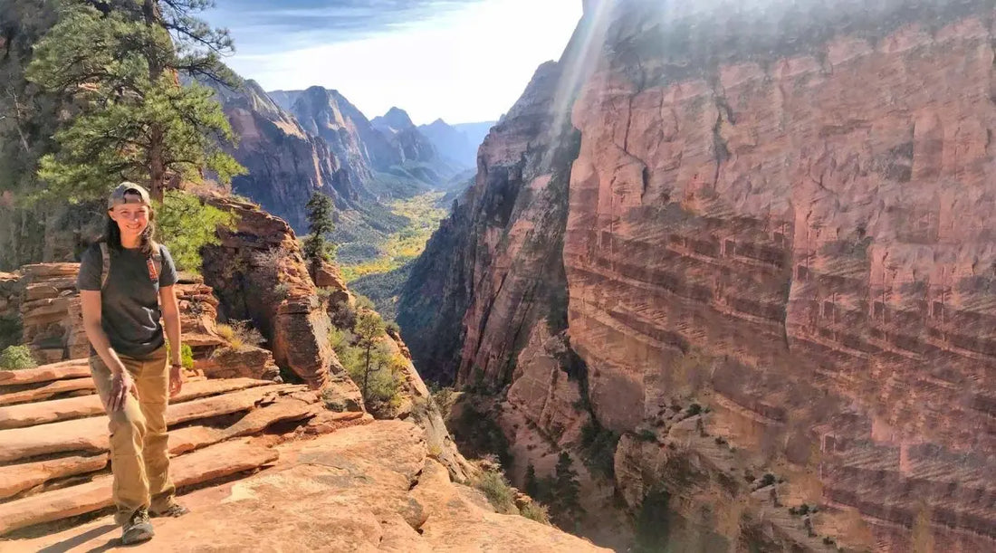 Whitney Thomas standing on canyon edge. 
