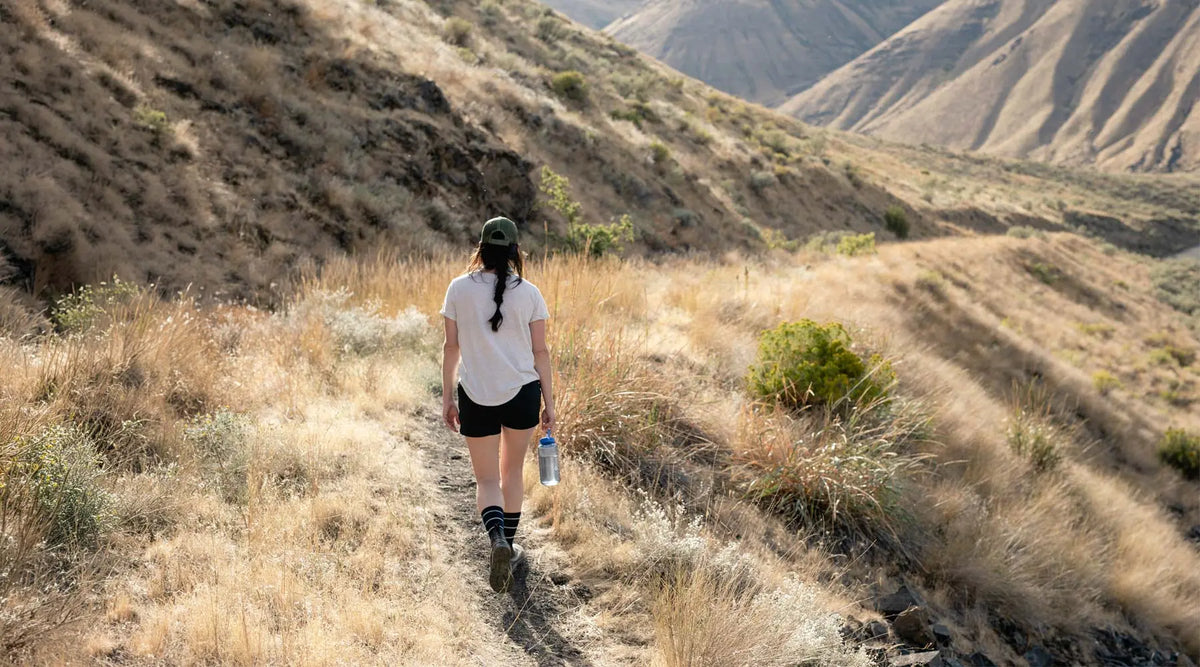 Women wearing Cloudline merino wool hiking socks on a dessert hike.