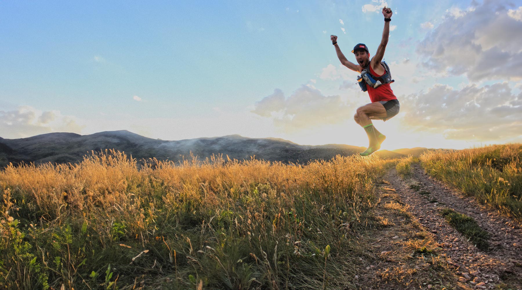 Man jumping in joy wearing Cloudline sock