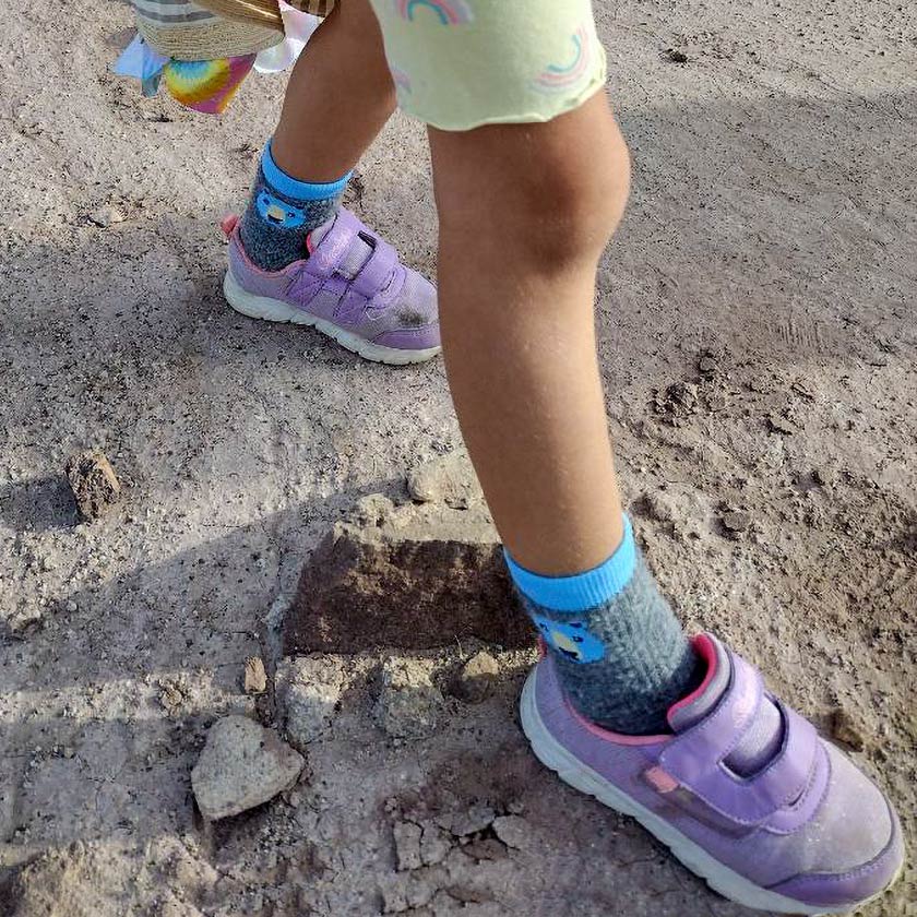 Child wearing Cloudline kid's socks on a hike.