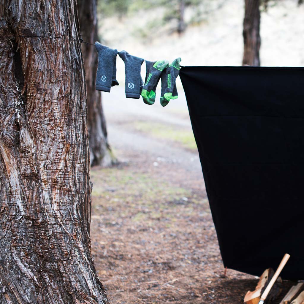 Cloudline socks line drying in camp. 