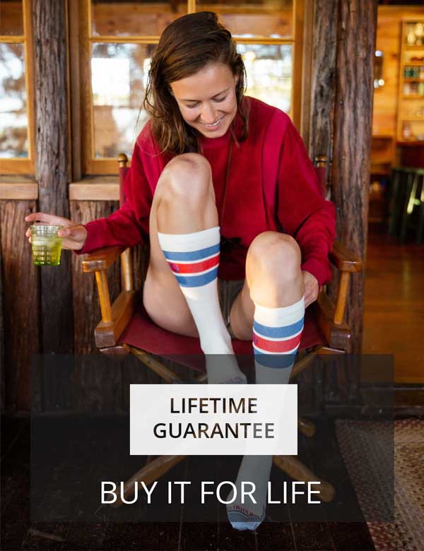 Women sitting in cabin wearing Cloudline socks