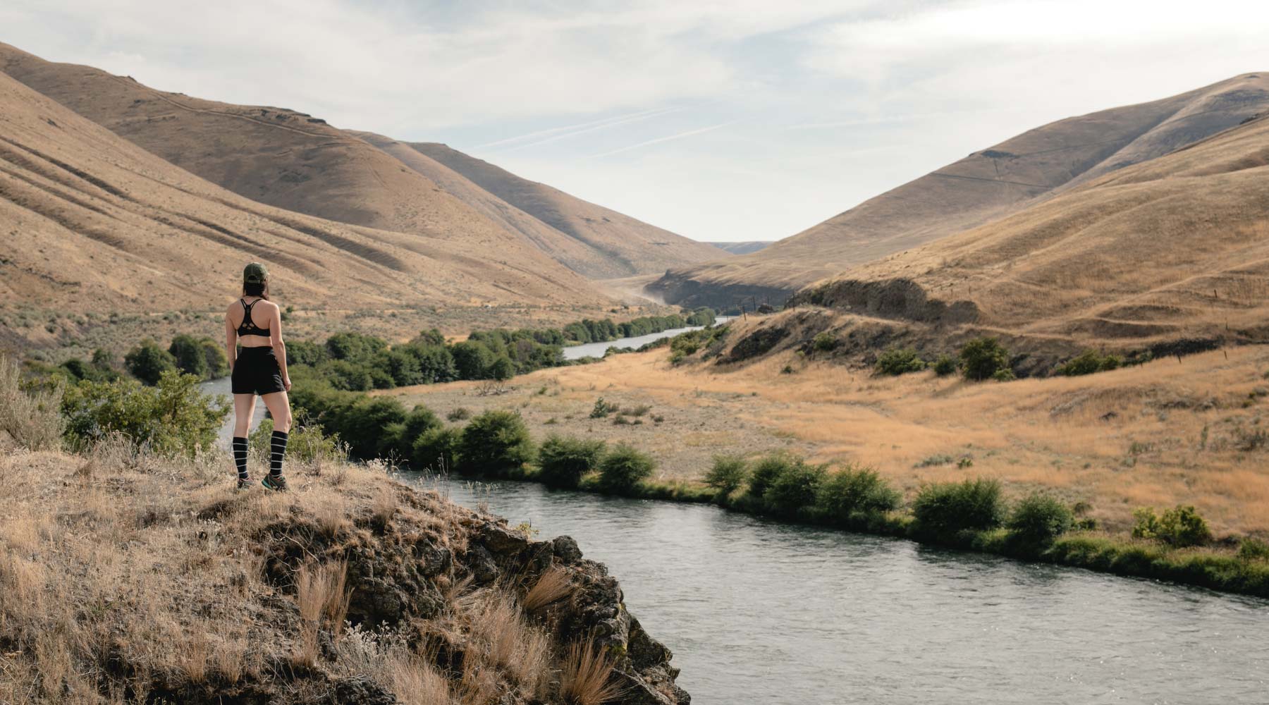 Women wearing Cloudline socks looking at hiking view