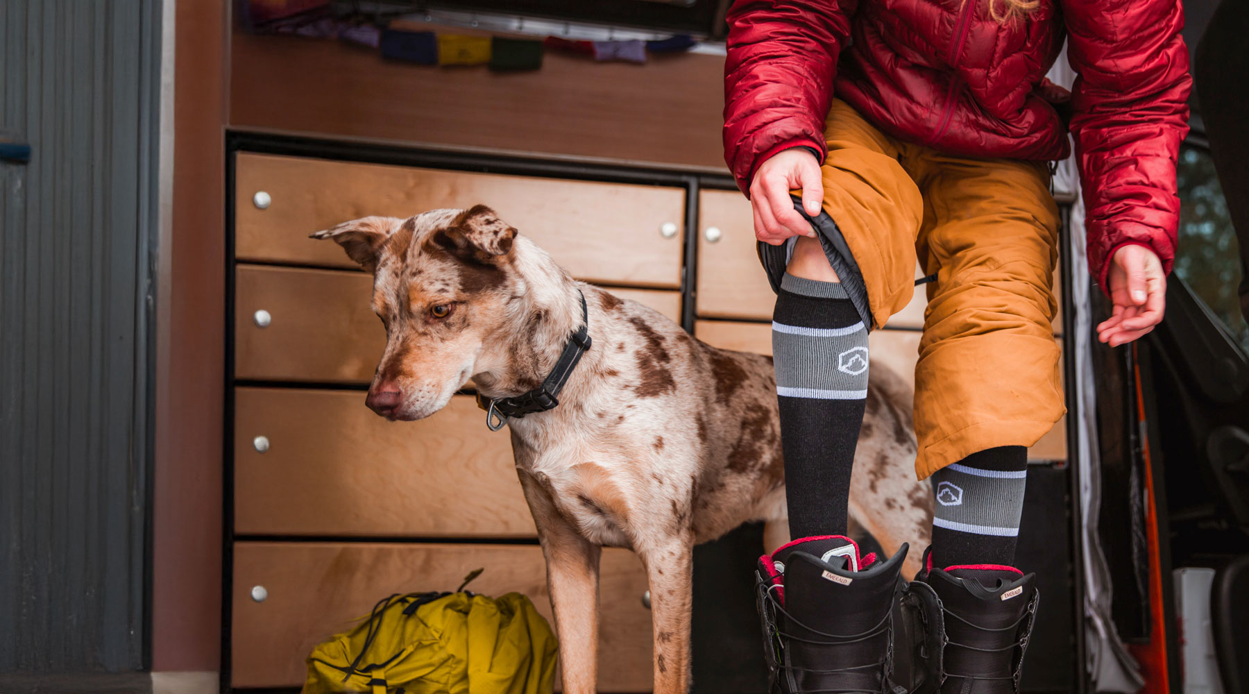 Women putting on her warm cloudline socks 