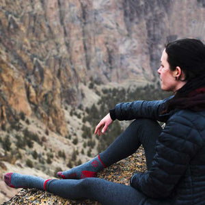 Women sitting on ridge overlooking valley wearing Cloudline 1/4 Top Running Socks